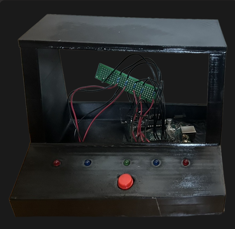 The cabinet with the screen removed, showing the perfboard, wires and Arduino behind the LEDs and button