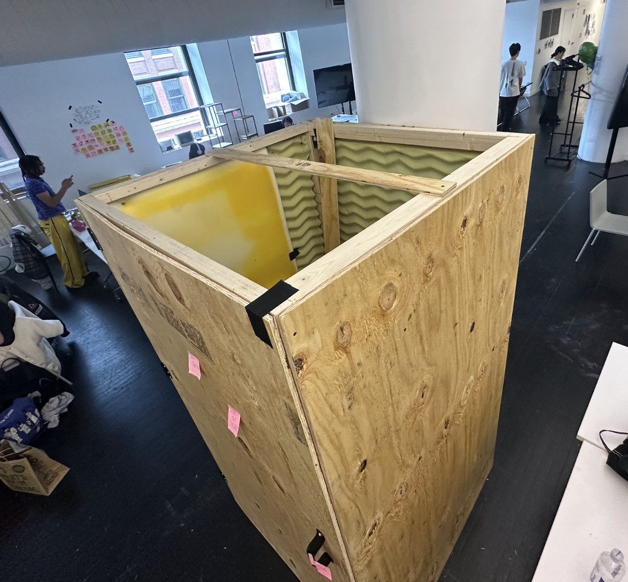 The booth with plywood walls and acoustic foam lining, seen from above